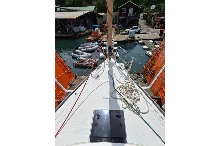 Bermuda Yacht Photos Pics 2017 Dufour 412 Grand Large sailboat docked, view from deck with ropes and marina background.