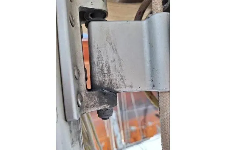 Bermuda Yacht Photos Pics Close-up of a metal hinge on a 2017 Dufour 412 Grand Large sailboat.