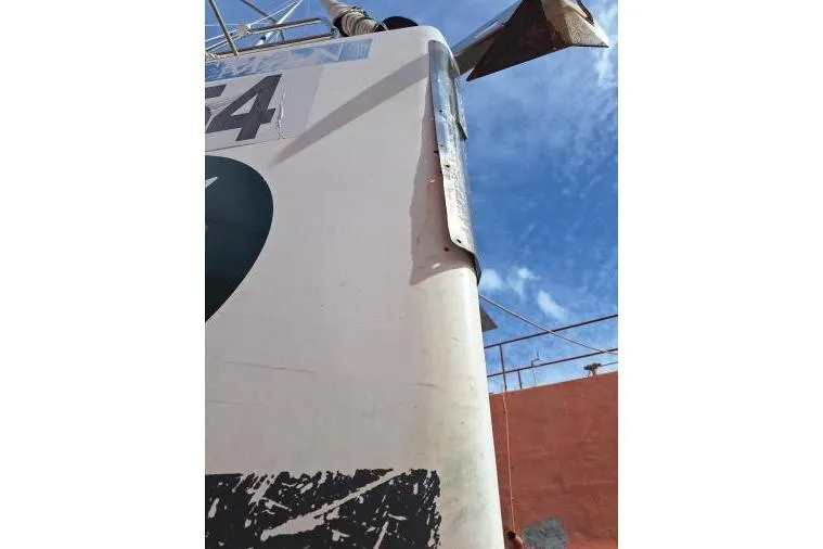 Bermuda Yacht Photos Pics 2017 Dufour 412 Grand Large sailboat hull with visible wear and sky background.