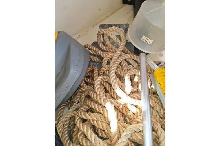 Bermuda Yacht Photos Pics Coiled rope and cleaning tools on a 2017 Dufour 412 Grand Large sailboat.