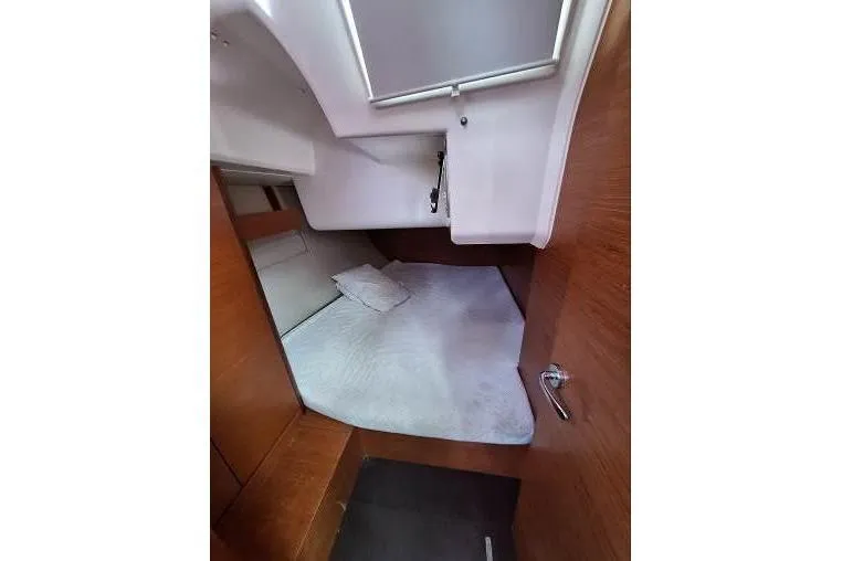 Bermuda Yacht Photos Pics 2017 Dufour 412 Grand Large cabin interior with bed and wooden finish.