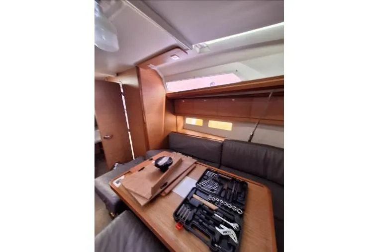 Bermuda Yacht Photos Pics Interior of 2017 Dufour 412 Grand Large yacht with tools on table.