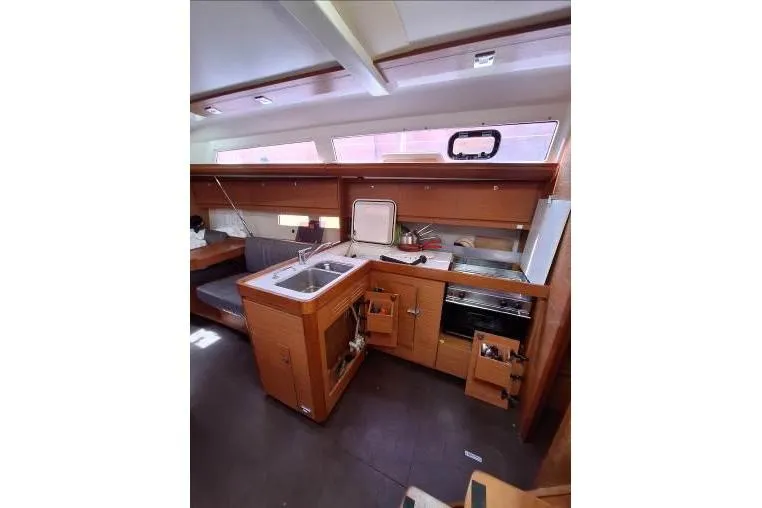 Bermuda Yacht Photos Pics Interior of 2017 Dufour 412 Grand Large yacht, featuring a compact kitchen area.