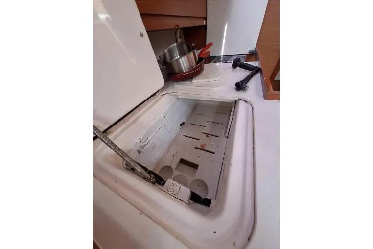 Bermuda Yacht Photos Pics Open storage compartment on 2017 Dufour 412 Grand Large yacht kitchen.