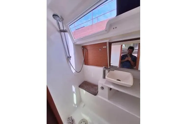 Bermuda Yacht Photos Pics Bathroom interior of 2017 Dufour 412 Grand Large yacht with shower and sink.