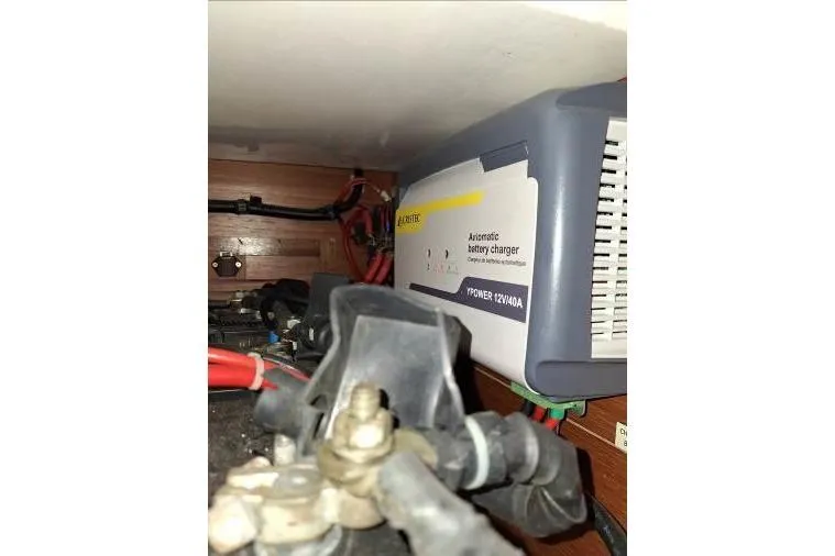 Bermuda Yacht Photos Pics Battery charger in a 2017 Dufour 412 Grand Large yacht, showing wiring and connections.