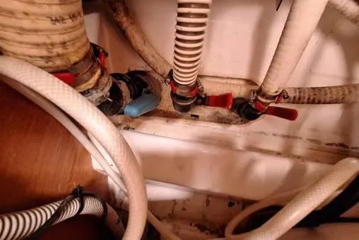 Bermuda Yacht Photos Pics Plumbing system of 2017 Dufour 412 Grand Large yacht with hoses and valves.