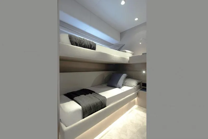  Yacht Photos Pics 2023 Ferretti 500 yacht interior with modern bunk beds and ambient lighting.