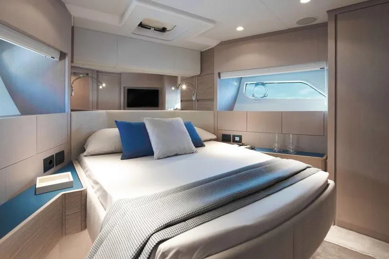  Yacht Photos Pics Luxurious bedroom interior of 2023 Ferretti 500 yacht with modern design and elegant furnishings.