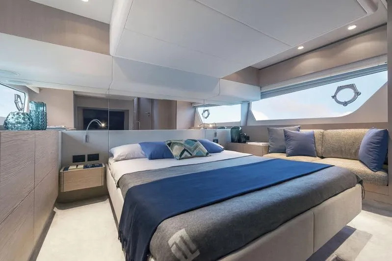  Yacht Photos Pics Luxurious 2023 Ferretti 500 yacht bedroom with modern decor and elegant furnishings.
