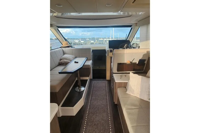  Yacht Photos Pics Luxurious interior of 2020 Regal 38 XO yacht with elegant seating and scenic view.