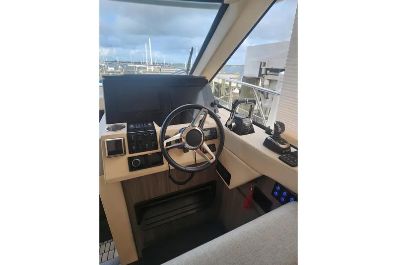  Yacht Photos Pics 2020 Regal 38 XO yacht helm with steering wheel and control panel.