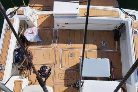  Yacht Photos Pics 2007 Tiara Yachts 3600 Open boat deck with fishing gear and storage compartments.