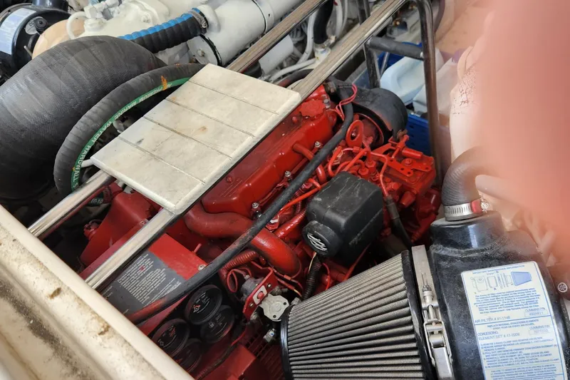  Yacht Photos Pics Engine compartment of a 2007 Tiara Yachts 3600 Open, showcasing red engine components.