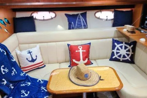  Yacht Photos Pics Nautical-themed interior of 2007 Tiara Yachts 3600 Open with anchor pillows and decor.