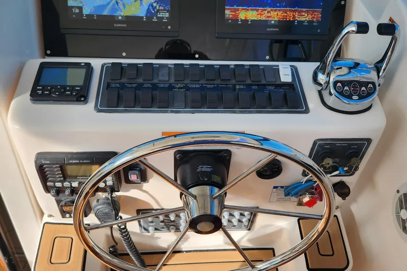  Yacht Photos Pics 2007 Tiara Yachts 3600 Open helm with steering wheel, controls, and navigation displays.