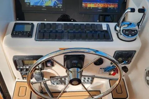  Yacht Photos Pics 2007 Tiara Yachts 3600 Open helm with steering wheel and navigation controls.