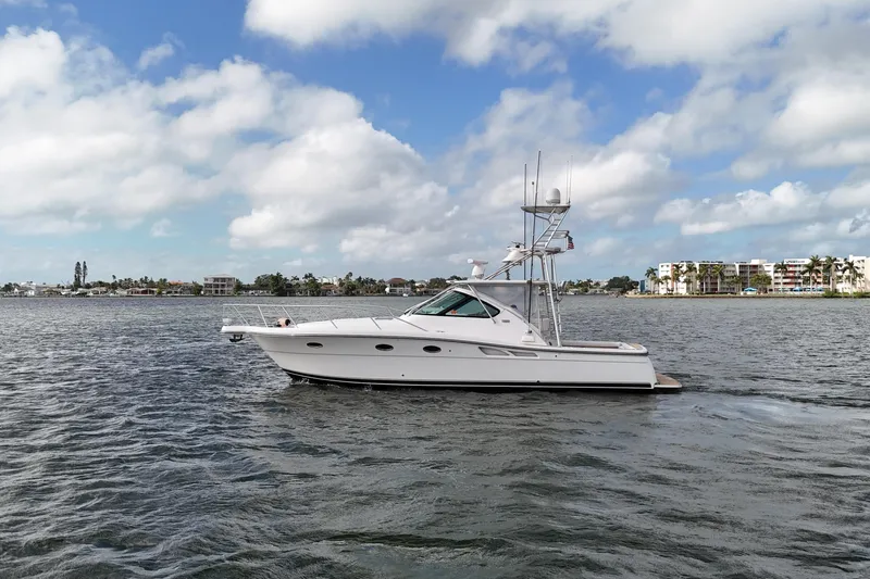  Yacht Photos Pics 2007 Tiara Yachts 3600 Open cruising on a scenic waterway under a partly cloudy sky.
