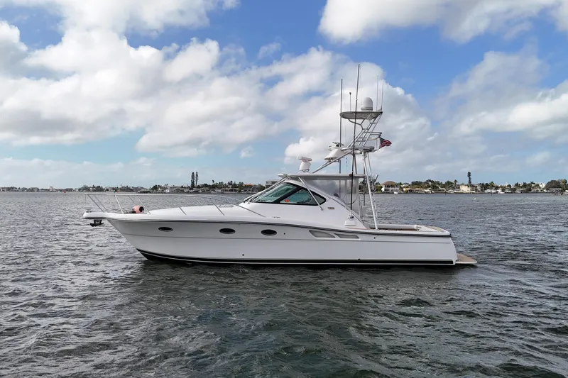  Yacht Photos Pics 2007 Tiara Yachts 3600 Open cruising on a calm sea under a partly cloudy sky.