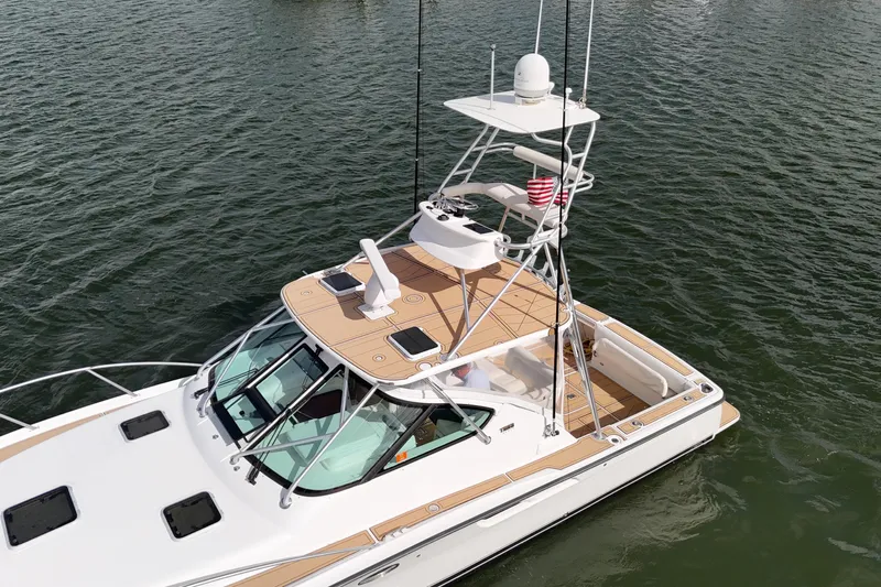  Yacht Photos Pics 2007 Tiara Yachts 3600 Open on water, featuring sleek design and spacious deck.