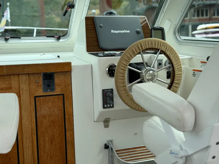 Skookum Yacht Photos Pics 2009 Back Cove 29 boat helm with Raymarine navigation system and wooden accents.