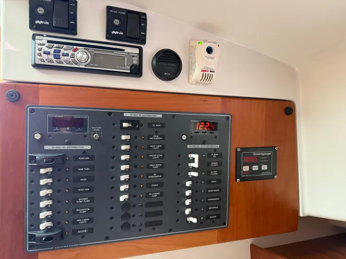 Skookum Yacht Photos Pics Electrical control panel on a 2009 Back Cove 29 boat, featuring various switches and gauges.