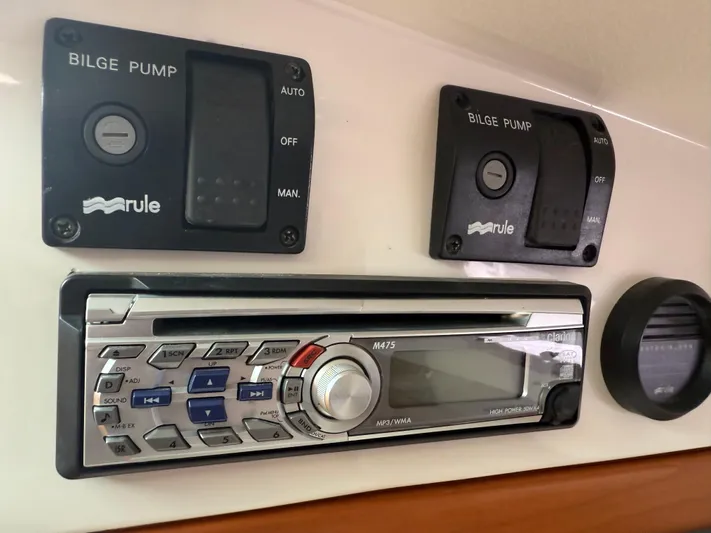 Skookum Yacht Photos Pics Control panel of a 2009 Back Cove 29 boat with bilge pump switches and stereo system.