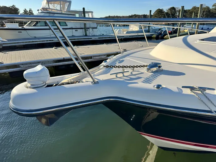 In Pursuit Yacht Photos Pics 2011 Pursuit OS 375 Offshore at dock, close-up of bow.