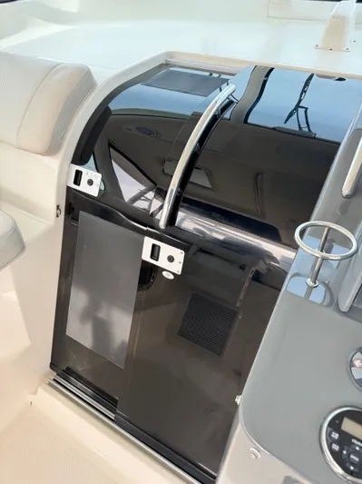 In Pursuit Yacht Photos Pics 2011 Pursuit OS 375 Offshore boat cabin with glass door.