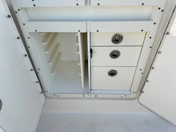 In Pursuit Yacht Photos Pics Storage compartment in 2011 Pursuit OS 375 Offshore boat.
