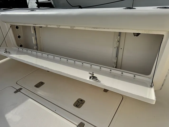 In Pursuit Yacht Photos Pics Open storage compartment on a 2011 Pursuit OS 375 Offshore boat.