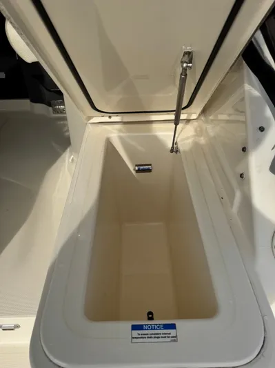 In Pursuit Yacht Photos Pics Open storage compartment in 2011 Pursuit OS 375 Offshore boat.