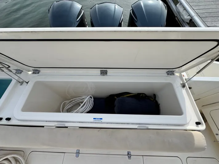 In Pursuit Yacht Photos Pics 2011 Pursuit OS 375 Offshore storage compartment with ropes and bag.