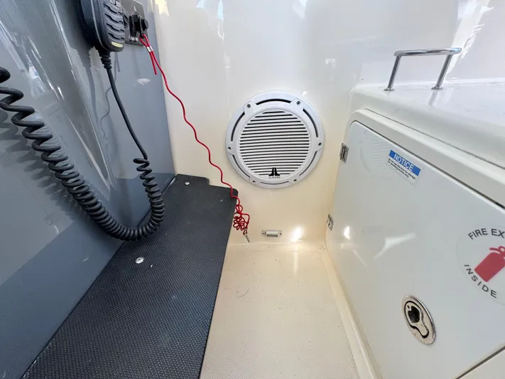 In Pursuit Yacht Photos Pics Interior of a Pursuit OS 375 Offshore boat, featuring speaker and radio.