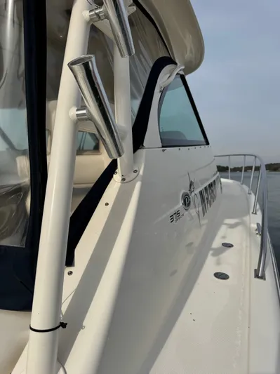 In Pursuit Yacht Photos Pics 2011 Pursuit OS 375 Offshore boat, side view.