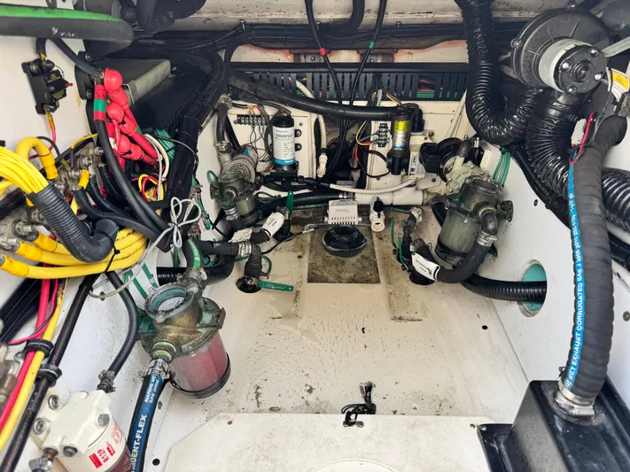 In Pursuit Yacht Photos Pics Engine compartment of a 2011 Pursuit OS 375 Offshore boat.