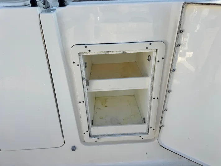 In Pursuit Yacht Photos Pics Storage compartment on a 2011 Pursuit OS 375 Offshore boat.