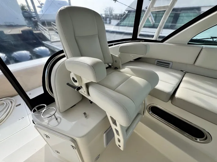 In Pursuit Yacht Photos Pics Interior of a 2011 Pursuit OS 375 Offshore boat with luxurious captain's chair.