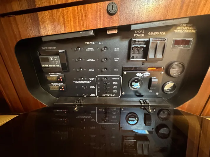 In Pursuit Yacht Photos Pics Control panel of 2011 Pursuit OS 375 Offshore with generator and power connections.