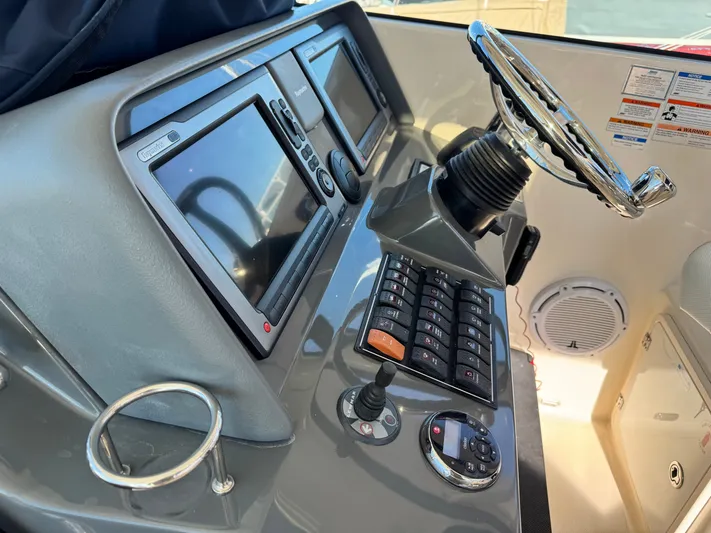 In Pursuit Yacht Photos Pics 2011 Pursuit OS 375 Offshore helm with electronics.