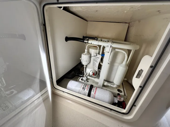 In Pursuit Yacht Photos Pics 2011 Pursuit OS 375 Offshore engine compartment with fire extinguisher.