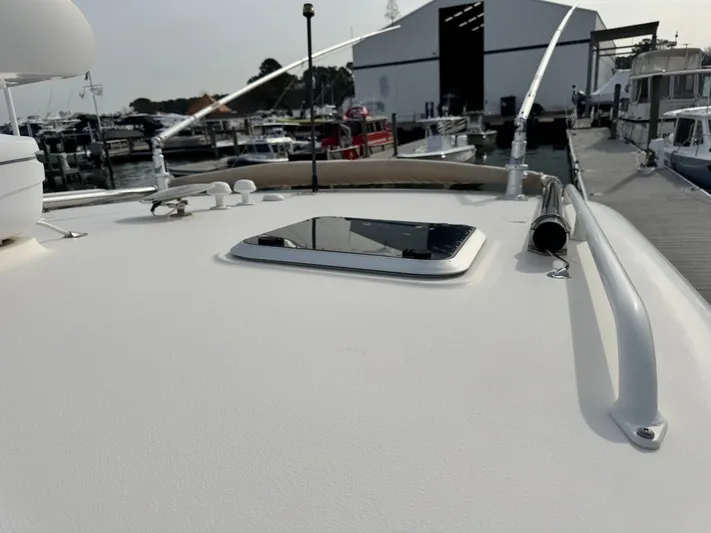 In Pursuit Yacht Photos Pics Pursuit OS 375 Offshore 2011 on dock, close-up of deck.