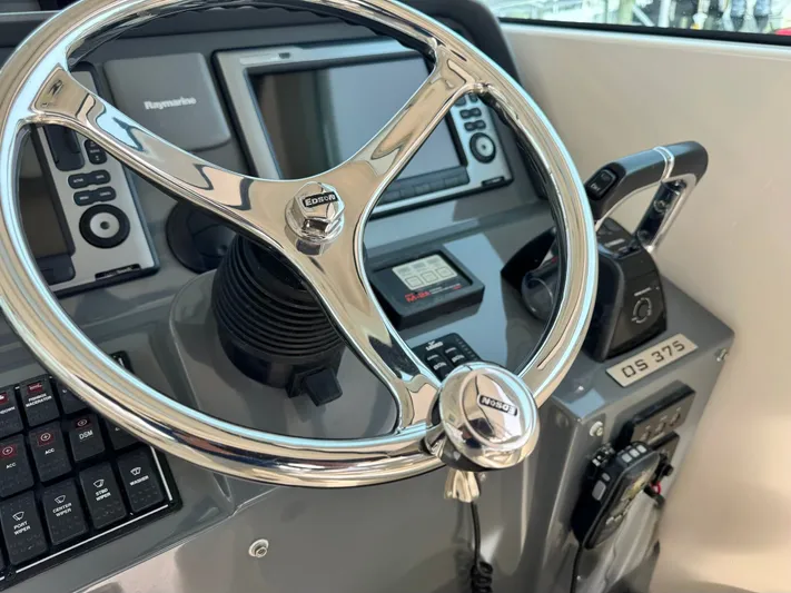 In Pursuit Yacht Photos Pics 2011 Pursuit OS 375 Offshore helm with Raymarine system.