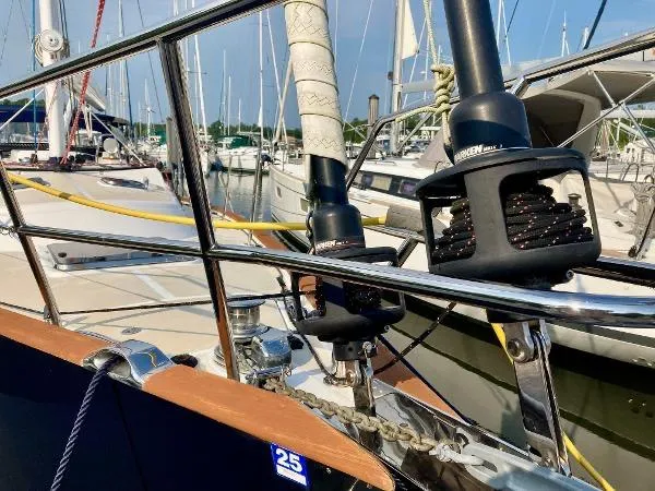 Tangaroa Yacht Photos Pics Close-up of a 2015 Tartan 4000 sailboat deck with rigging and winches in a marina.