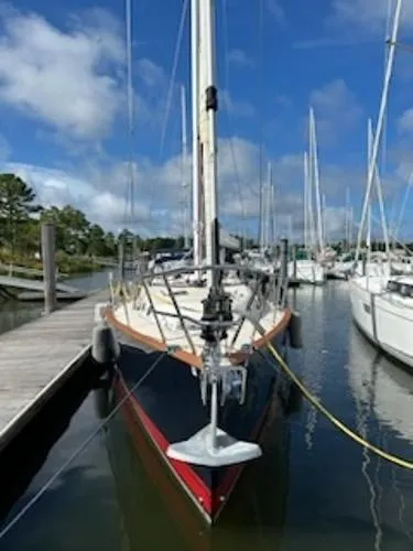 Tangaroa Yacht Photos Pics Tartan 4000 sailboat, 2015 model, docked in a marina under a clear blue sky.
