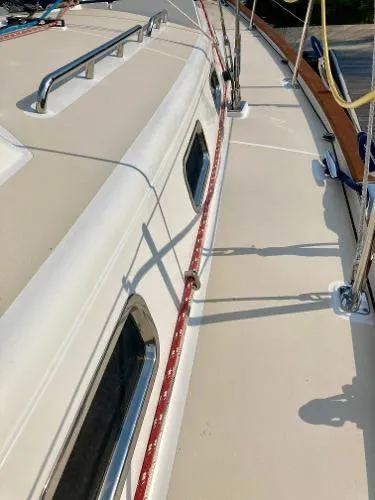 Tangaroa Yacht Photos Pics 2015 Tartan 4000 sailboat deck with red ropes and metal railings.