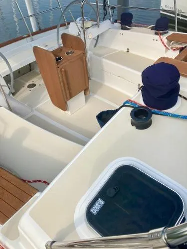 Tangaroa Yacht Photos Pics 2015 Tartan 4000 sailboat cockpit with wooden accents and covered seating.