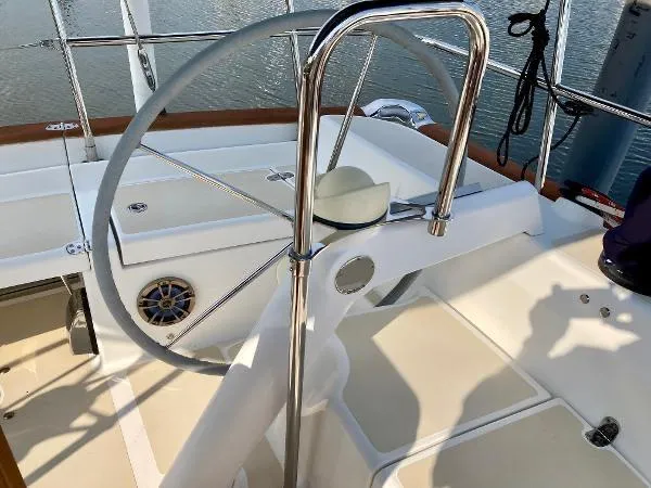 Tangaroa Yacht Photos Pics Tartan 4000 sailboat helm, 2015 model, featuring a sleek steering wheel and polished metal details.