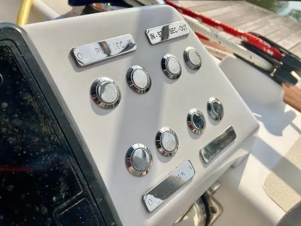 Tangaroa Yacht Photos Pics Control panel of a 2015 Tartan 4000 sailboat with labeled buttons.