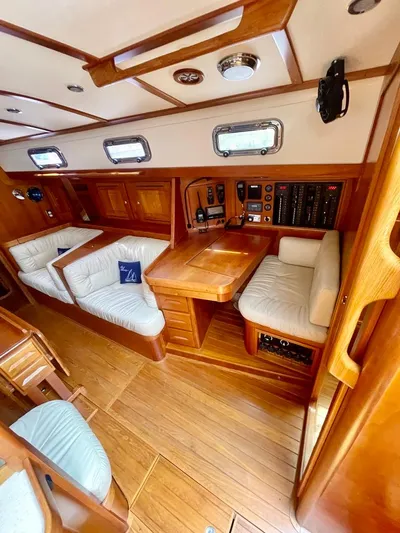 Tangaroa Yacht Photos Pics Luxurious 2015 Tartan 4000 yacht interior with wood finish and plush seating.